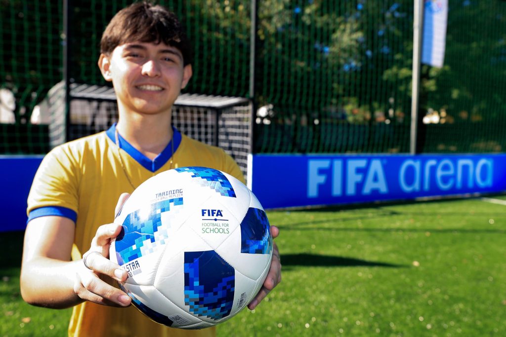 Student on the pitch of the FIFA Arena project in Luque.