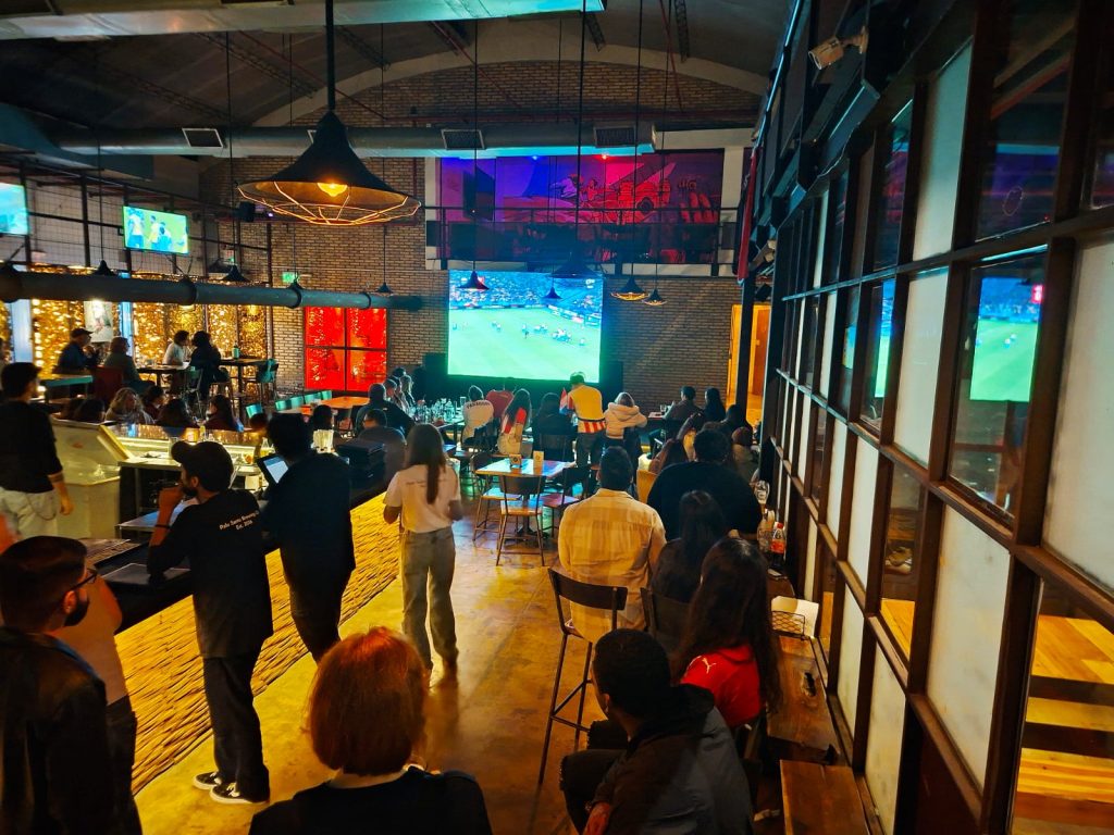 Fans at Palo Santo watching the Paraguayan National Team.