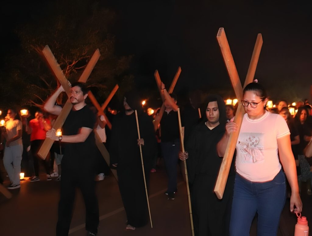 People carrying crosses at the Great Way Of The Cross 